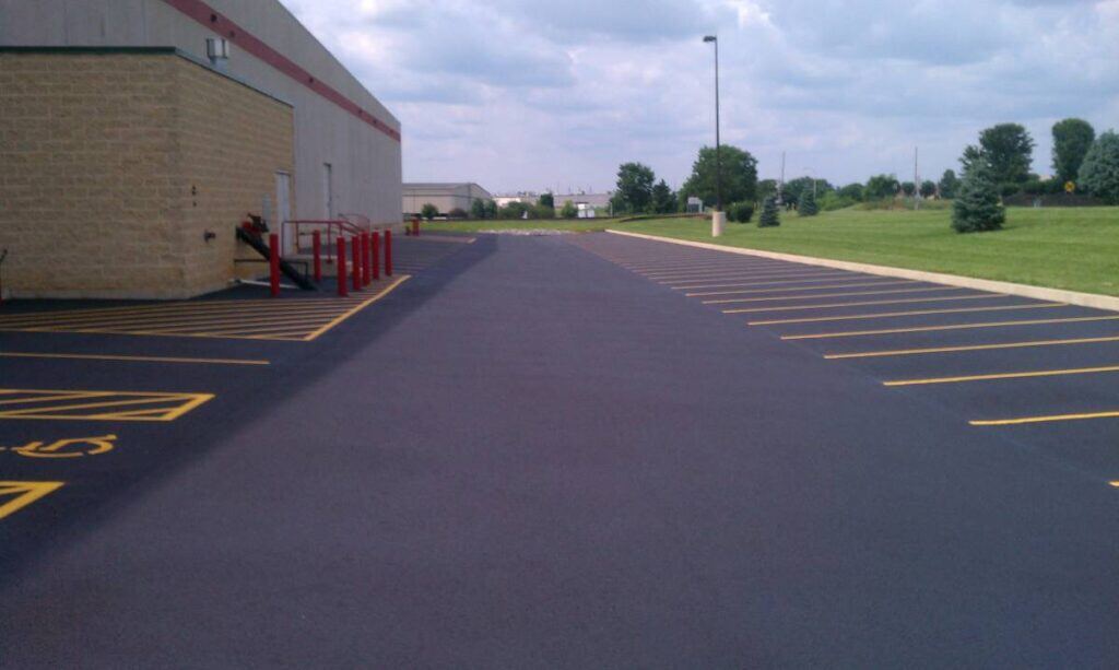 Freshly sealcoated parking lot with crisp striping after treatment Beaufort SC